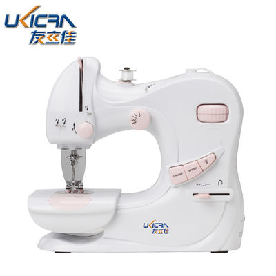 Mini machine à coudre UFR-601 pour le ménage avec une longueur de couture de 0 à 5 mm en blanc et rose